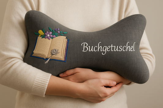 Person hält Leseknochen Buchgetuschel im Arm